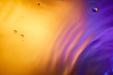 orange and purple color abstract background from mixed water and oil