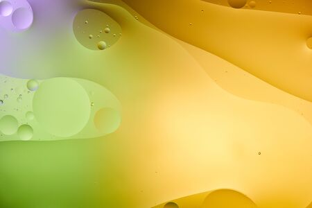 Beautiful abstract orange, purple and green color background from mixed water and oil 