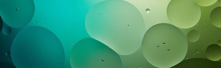 panoramic shot of Beautiful abstract background from mixed water and oil in turquoise and green colorの写真素材