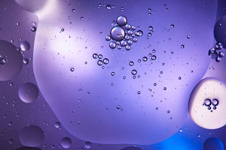 creative abstract blue and purple color background from mixed water and oil 
