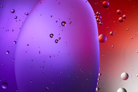 creative abstract purple and red color texture from mixed water and oil bubbles