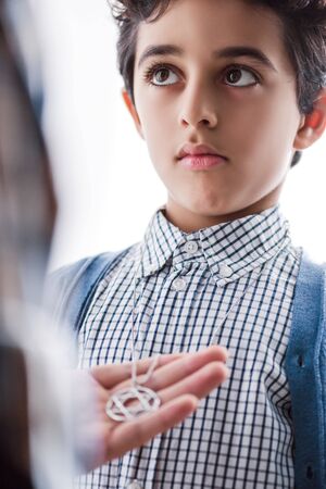 cropped view of jewish father holding star of david necklace on sonの写真素材