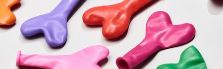 Panoramic shot of colorful balloons in heart shape on grey backgroundの写真素材