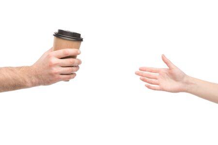 cropped view of man giving paper cup to woman isolated on white