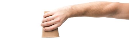 panoramic shot of man holding paper cup isolated on whiteの写真素材