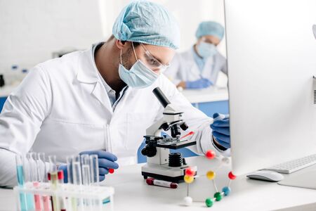 selective focus of genetic consultant doing dna test in lab