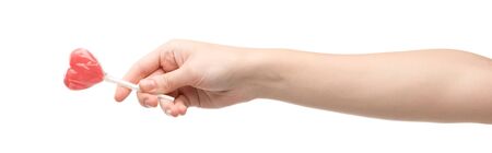 panoramic shot of woman holding heart-shaped lollipop isolated on whiteの写真素材
