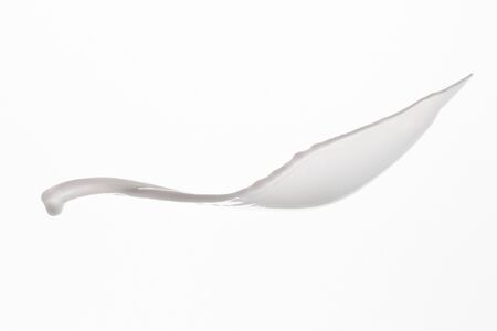 pure fresh white milk splash isolated on whiteの写真素材
