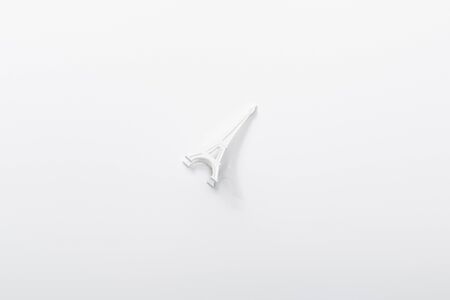 top view of small eiffel tower statuette isolated on whiteの写真素材
