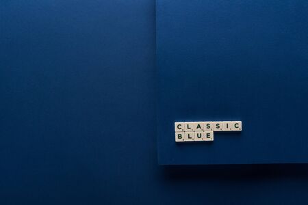 top view of classic blue lettering on cubes on blue background