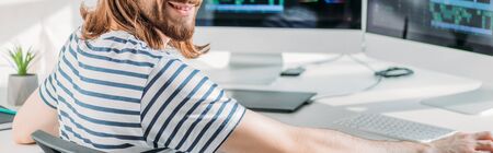 panoramic shot of cheerful editor in studio