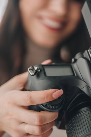 selective focus of art editor holding digital camera