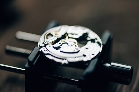 Close up view of open mechanical wristwatch on movement holderの写真素材