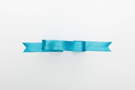 top view of blue decorative satin ribbon isolated on white