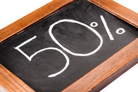 number 50 and percent sign written on chalkboard isolated on white