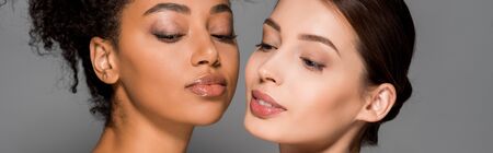 panoramic shot of tender multiethnic women with clean faces, isolated on grey