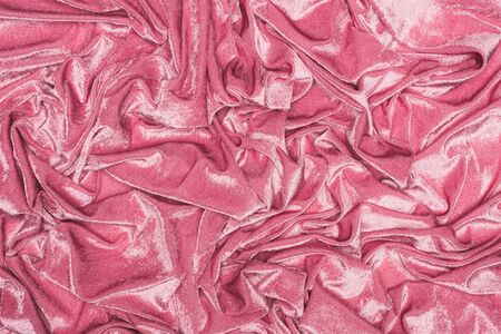Top view of background of crumpled pink velour textileの写真素材