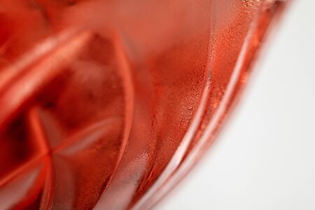 close up of red cocktail in glass isolated on whiteの写真素材