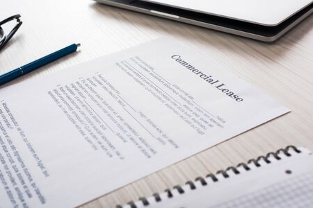 selective focus of document with commercial lease lettering on desk