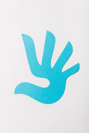 top view of blue paper cut print isolated on white, human rights conceptの写真素材