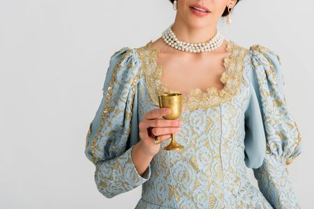 cropped view of queen holding cup isolated on grey