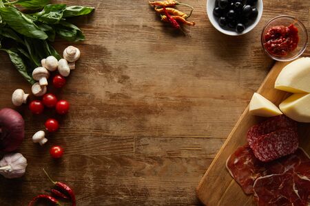top view of  ingredients for pizza on wooden table