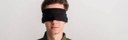 panoramic shot of blindfolded man isolated on white, human rights conceptの写真素材