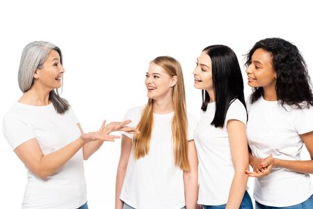 four multicultural women smiling isolated on whiteの写真素材