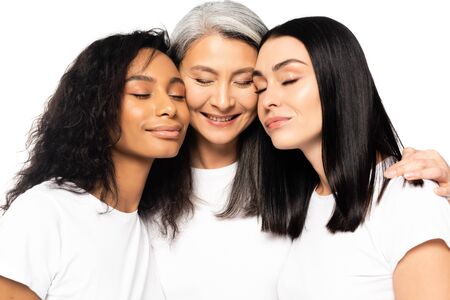 cheerful multicultural women with closed eyes isolated on white