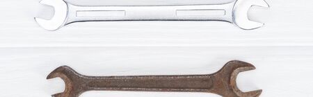 Top view of shiny and rustle on white wooden background, panoramic shot