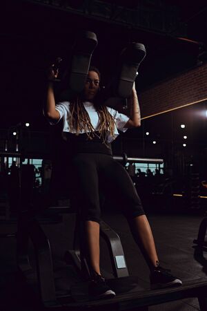 african american woman working out on gym machine