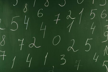 Arithmetic numbers on green school chalkboard