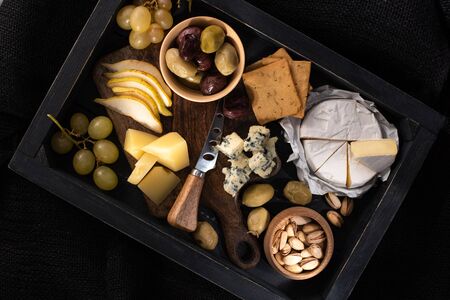 Top view of food composition on tray isolated on black