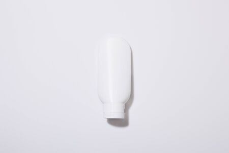 Top view of cosmetic tube on grey backgroundの写真素材