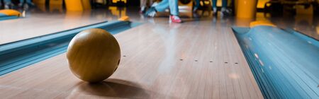 panoramic shot of bowling ball on skittle alley in bowling clubの写真素材