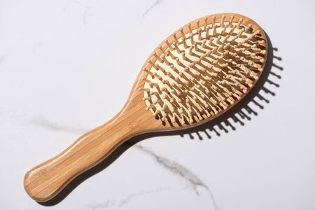 Top view of wooden hair brush on white background, zero waste conceptの写真素材