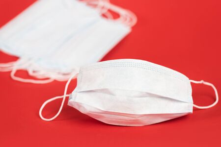 selective focus of protective medical masks on redの写真素材
