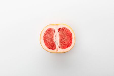 Top view of grapefruit half on white backgroundの写真素材