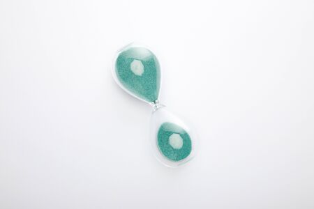 top view of hourglass on white background