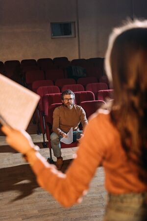 selective focus of stage director and actress with screenplay in theaterの写真素材