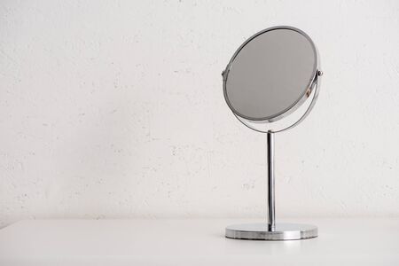 Round mirror on white background, zero waste conceptの写真素材