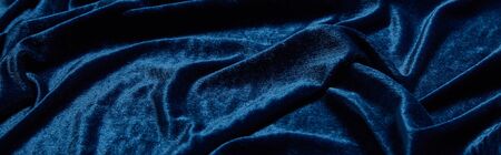 close up view of blue soft and crumpled velour textured cloth, panoramic shotの写真素材