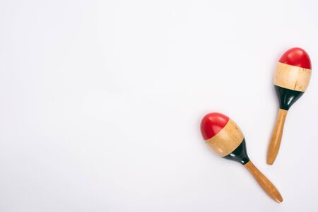 Top view of wooden colorful maracas on white backgroundの写真素材