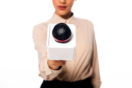 Cropped view of african american journalist presenting microphone isolated on whiteの写真素材