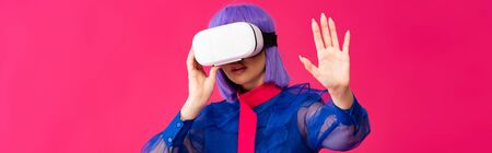 panoramic shot of attractive pop art girl in blue blouse and purple wig using virtual reality...