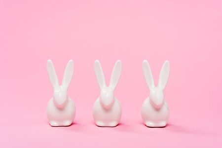 Decorative easter bunnies on pink backgroundの写真素材