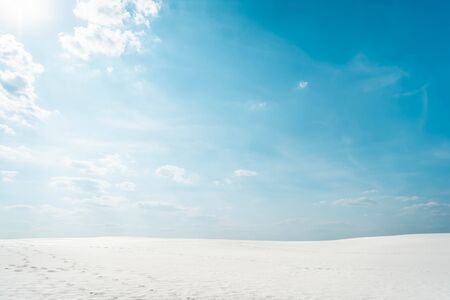 beautiful clean beach with white sand and blue sky with white cloudsの写真素材