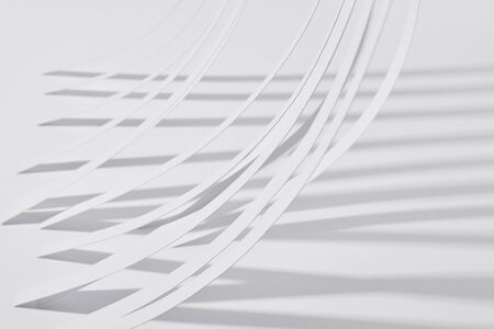 close up view of paper stripes with shadow on white backgroundの写真素材