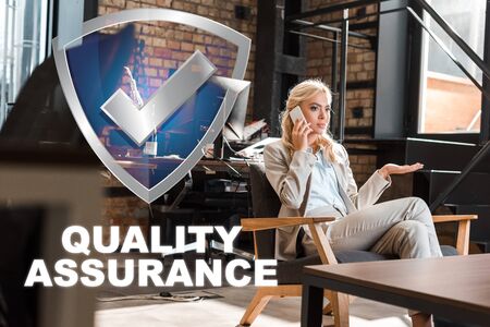 selective focus of serious businesswoman sitting in armchair with open arm and talking on smartphone, quality assurance illustrationの写真素材