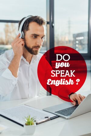 professional translator working online with headphones and laptop, do you speak English illustrationの写真素材